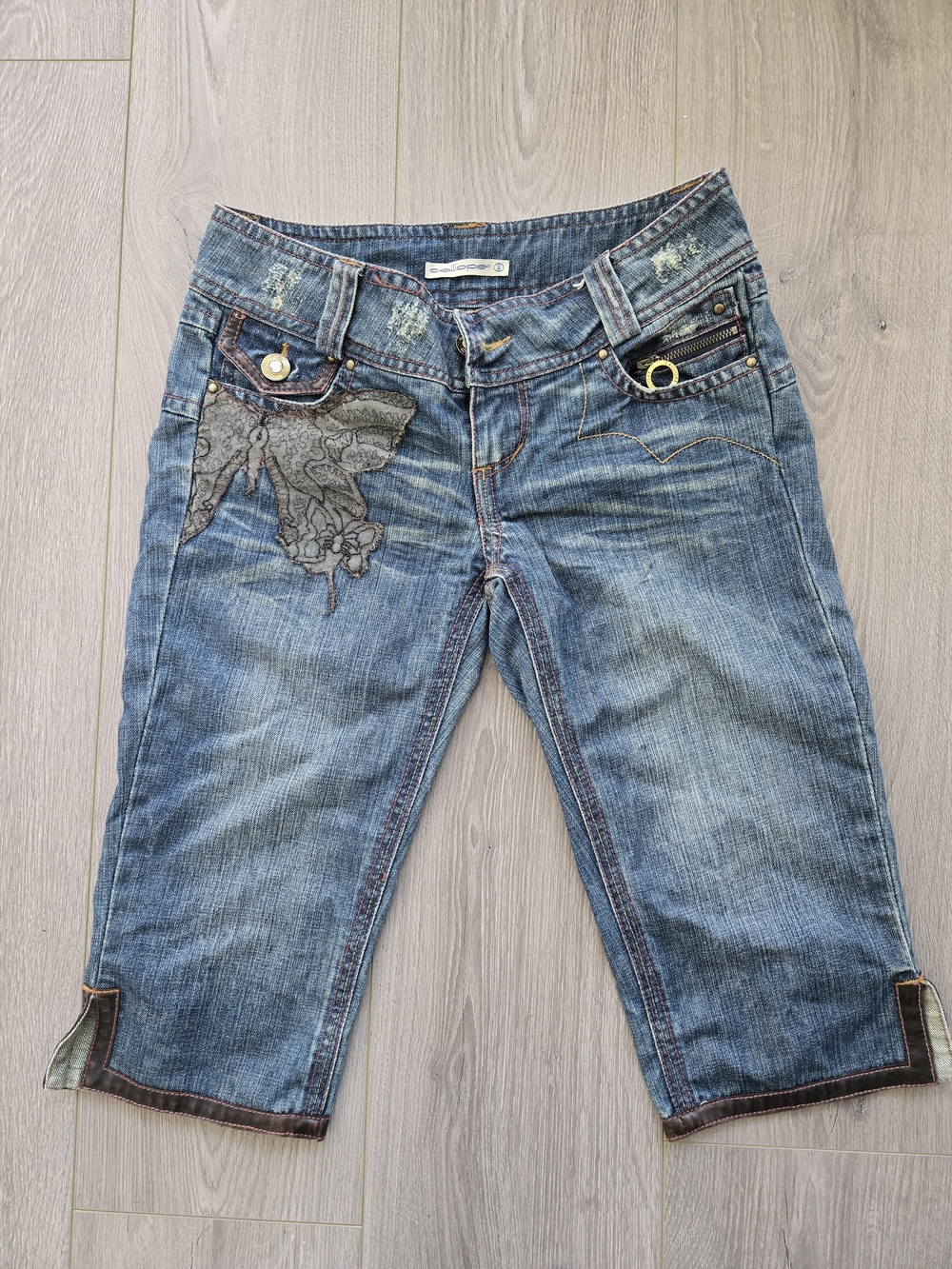Embroidered Blue Denim Capris with Decorative Accents